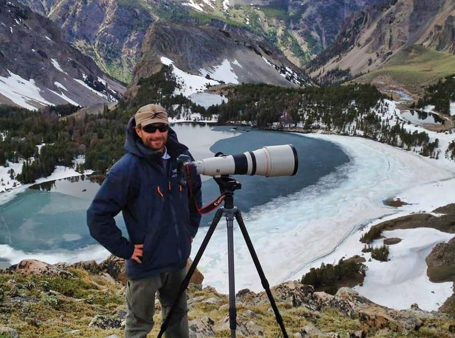 Nature photographer Robbie George working in a mountain landscape